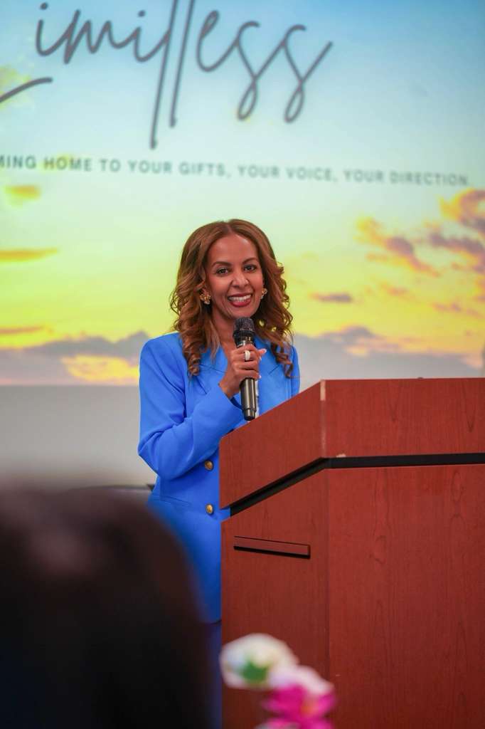 A speaker shares a reflection during the program.